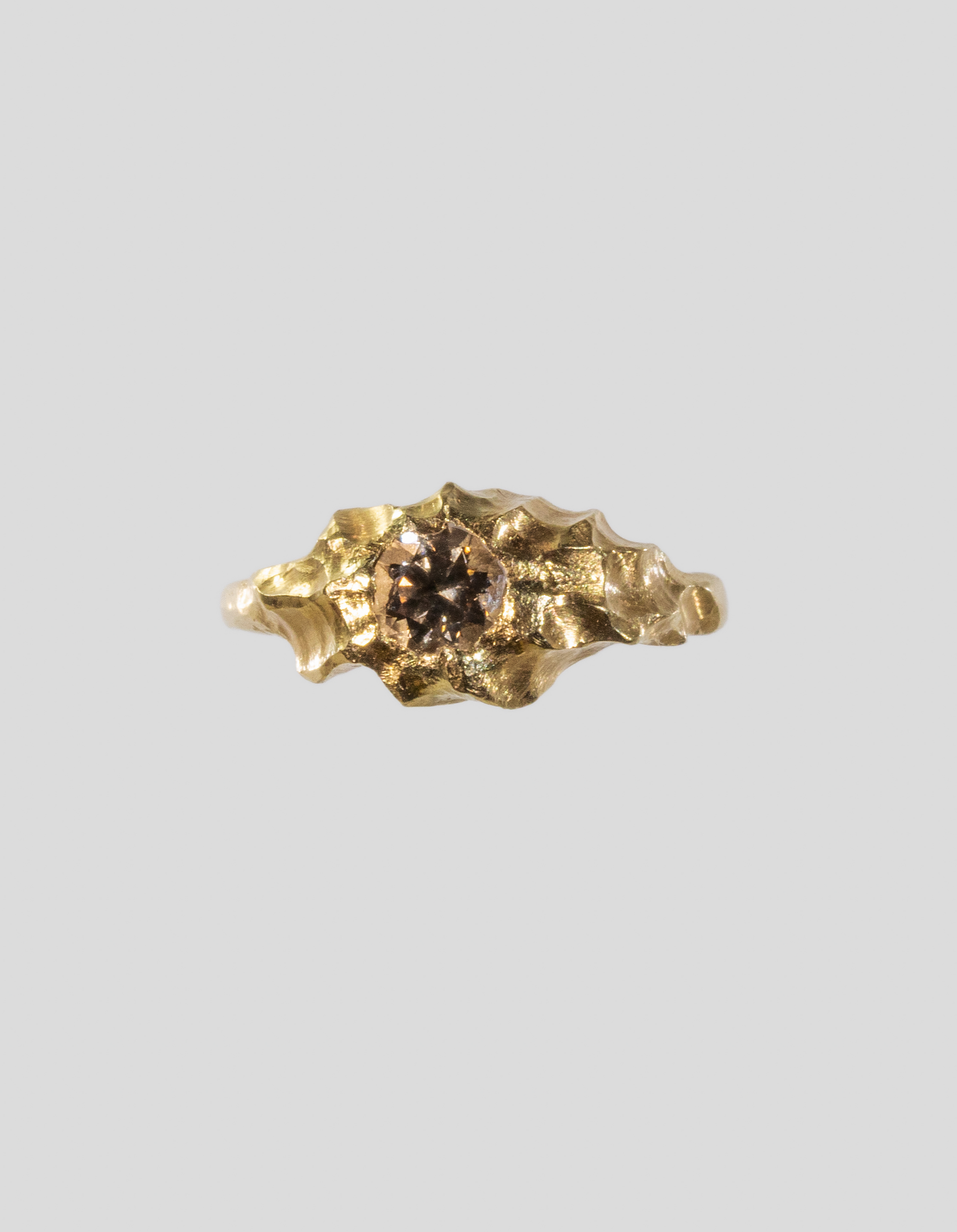 Gold_sculptural_engagement_ring_with_natural_champagne_diamond