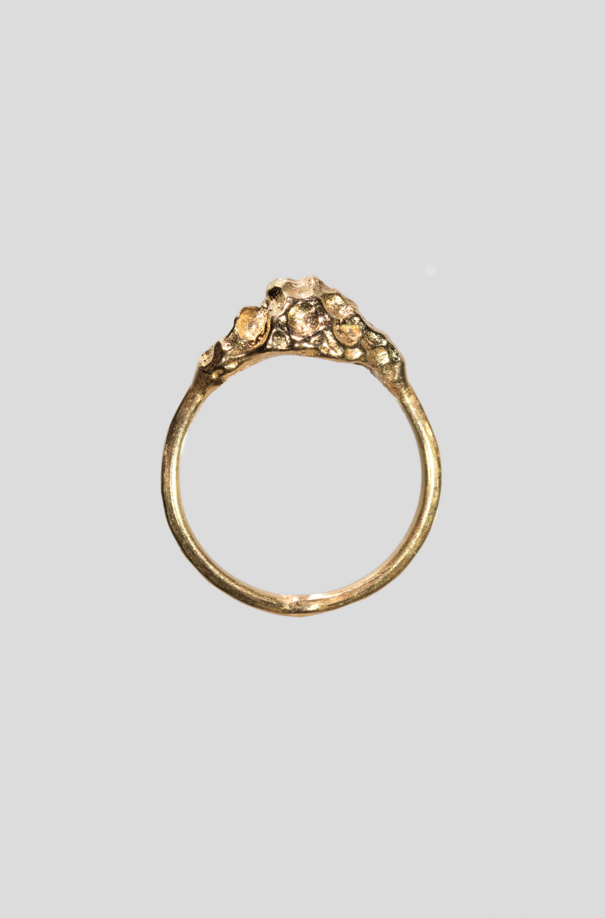 Gold textured design on a light gray background