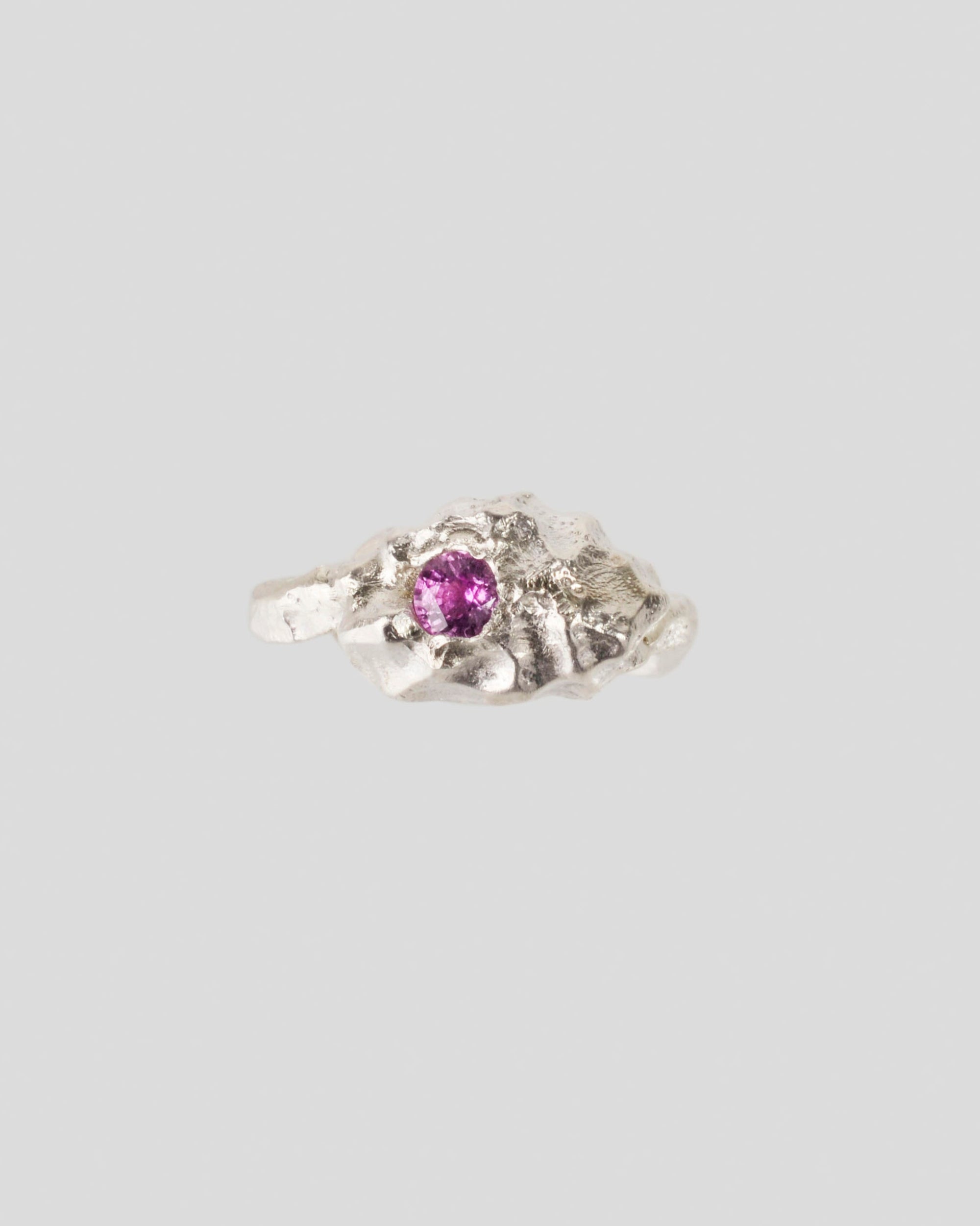 Handcrafted silver ring with natural pink sapphire – organic molten texture,