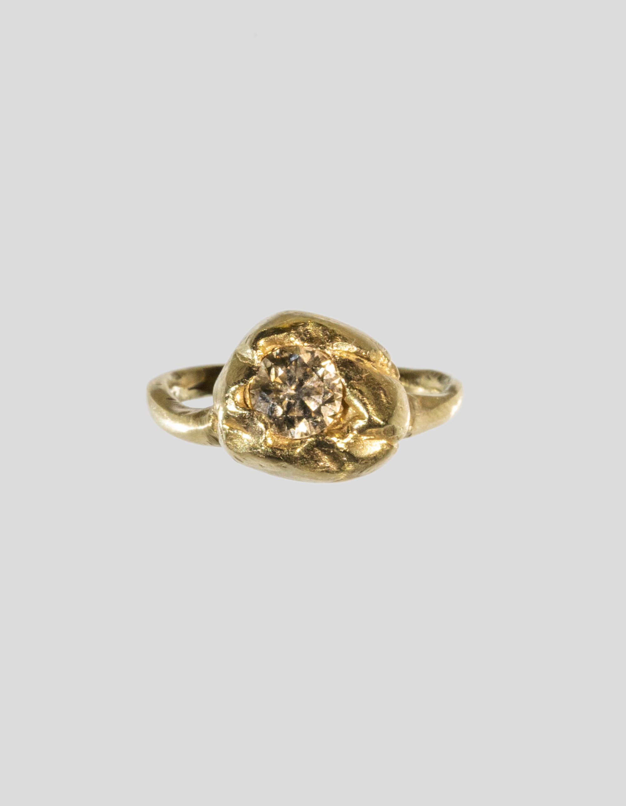 handcrafted_solitaire_engagement_rings_in_18k_gold